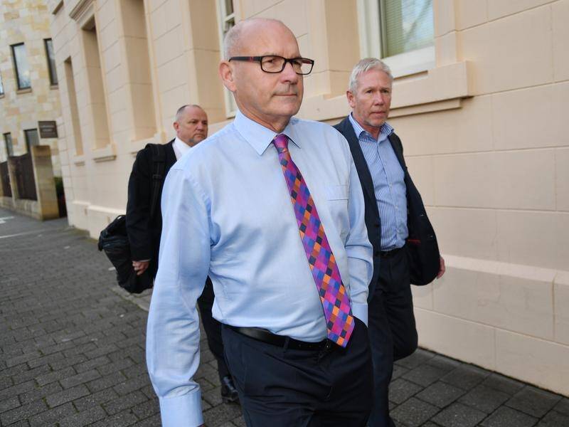 Former magistrate Bob Harrap (centre) has been jailed after admitting two deception charges.