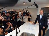 Scott Morrison took aim at Labor's record of "chaos" in government while campaigning in Perth.
