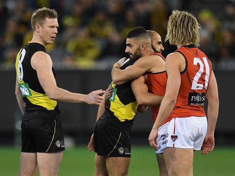 Bachar Houli and Adam Saad have embraced in the name of diversity during Friday night's coint toss.