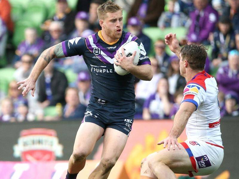Cameron Munster (l) believes the Storm still has two more gears despite their nine-game winning run.