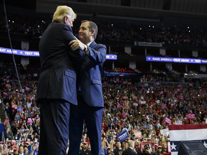 Old foes Donald Trump and Senator Ted Cruz greet each other at a midterm campaign rally in Houston.