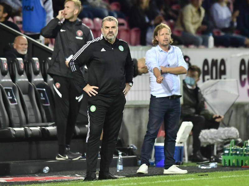 Celtic's Ange Postecoglou saw his side eliminated from the ECL by Bo Heniksen's (r) Midtjylland.