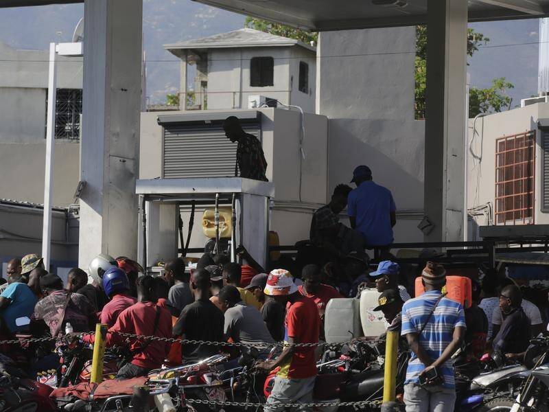 Operations at Haiti's main fuel import terminal have been suspended as armed men seized trucks. (AP PHOTO)