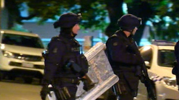 Police in full riot gear prepare to enter the Parkville youth centre.  Photo: Courtesy ABC News
