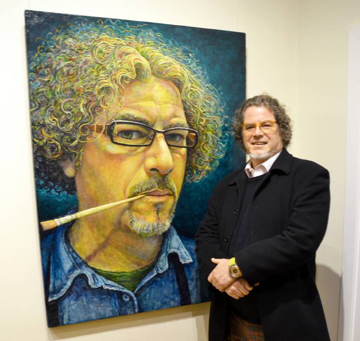 Winner of the John Copes Portrait Prize, Justin Pearson, with his portrait. 	Photo supplied