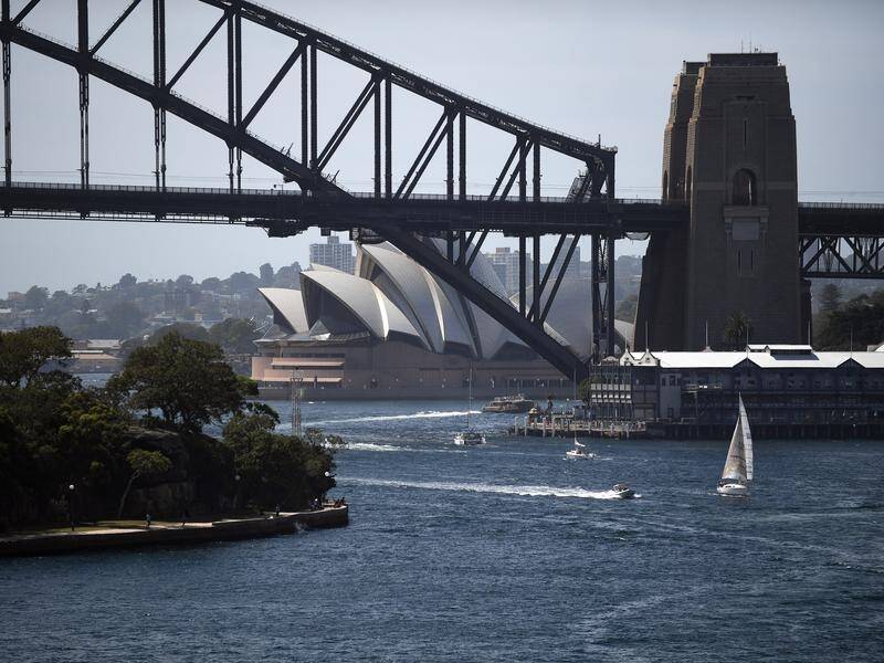 Ryan Gosling fights bad guys while skidding across Sydney Harbour Bridge in The Fall Guy. (Steven Saphore/AAP PHOTOS)