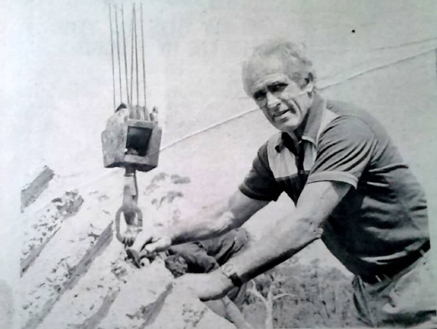 MONUMENTAL: Sculptor Joe Enfield helps with the raising of his concrete artwork in 1980. PHOTO: SH News/DBDH&FHS