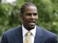 R&B singer R. Kelly faces charges including child pornography and enticement of minors. (AP PHOTO)