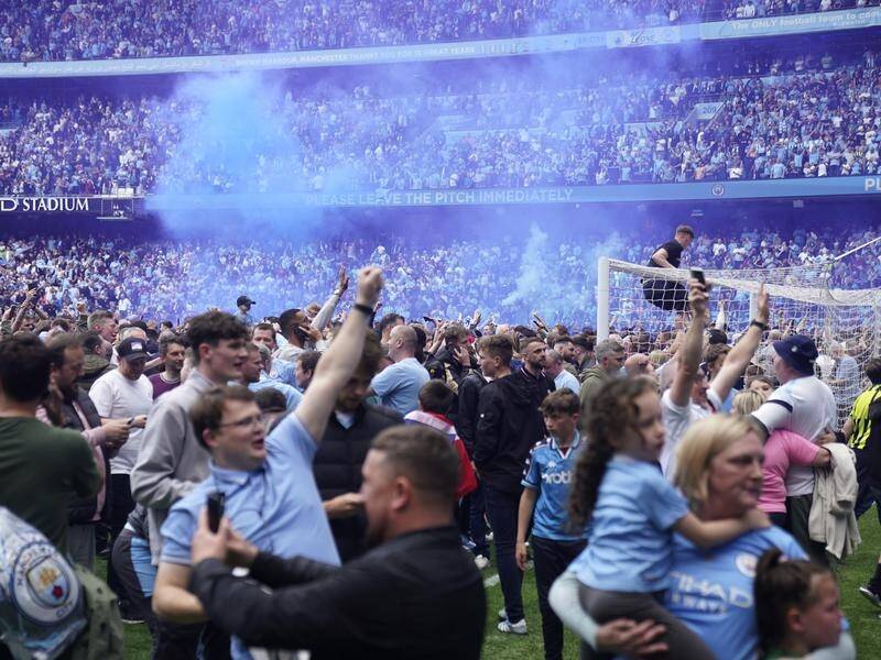 Aston Villa's Robin Olsen was attacked during a pitch invasion by Manchester City fans.