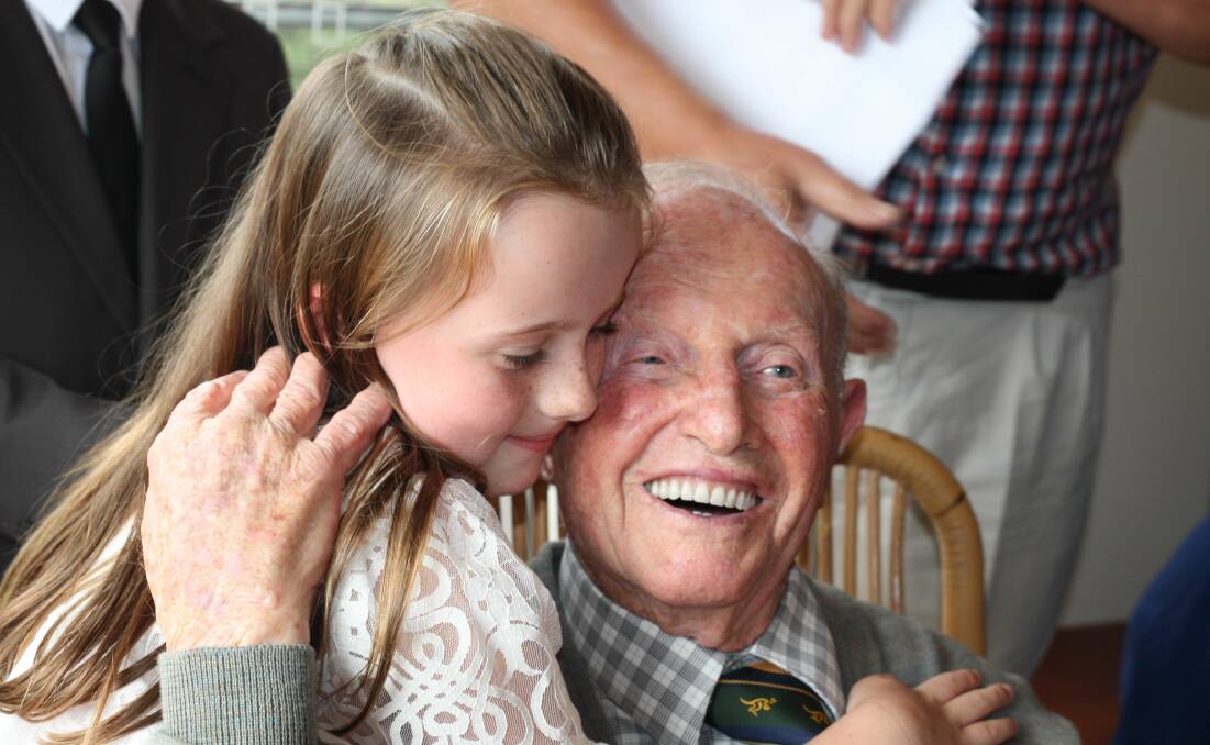 Emily Burt with her great-grandfather on his 100th birthday. Photo supplied