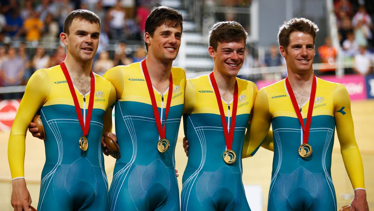 Gold medallists, from left,  Jack Bobridge, Luke Davison, Alex Edmondson and Glenn O'Shea of Australia look on during the medal ceremony for the Men’s 4000 metres Team Pursuit final at Sir Chris Hoy Velodrome during day one of the Glasgow 2014 Commonwealth Games in Glasgow, Scotland. (Photo by Clive Rose/Getty Images). 