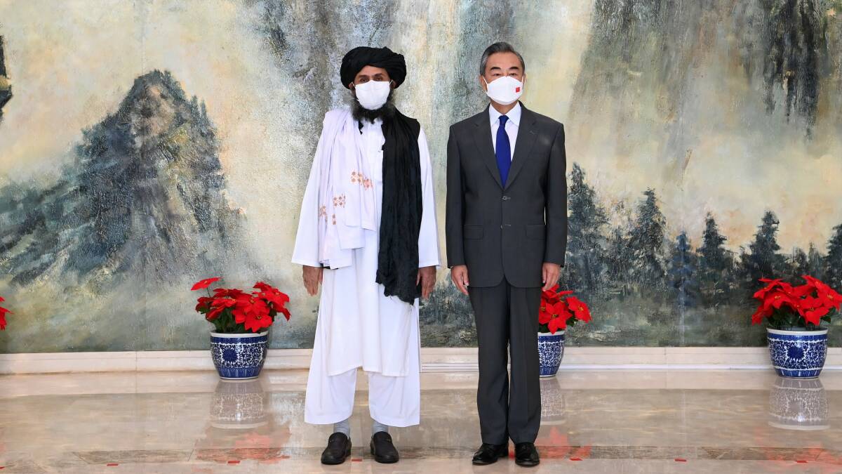China and the Taliban have a relationship - if an uneasy one. Pictured is Taliban political chief Mullah Abdul Ghani Baradar (left) with Chinese Foreign Minister Yi Wang in Tianjin on July 28. Picture: Getty Images
