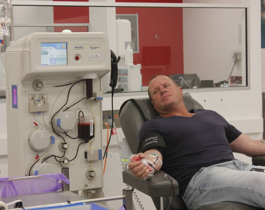 Generous: Neil Seaman donating blood at the Goulburn Donor Centre. Photo: Burney Wong. 