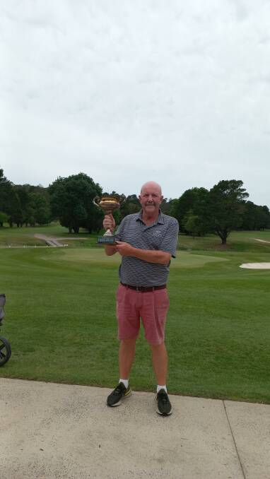 Peter Tancred holding aloft the Jordan Cup. Absent is winning partner Chris Oakley. Picture supplied. 