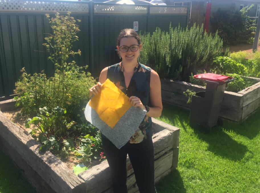 Waste education project and policy officer Phoebe Ward with some of the beeswax wraps you can learn to make in a waste reduction workshop.