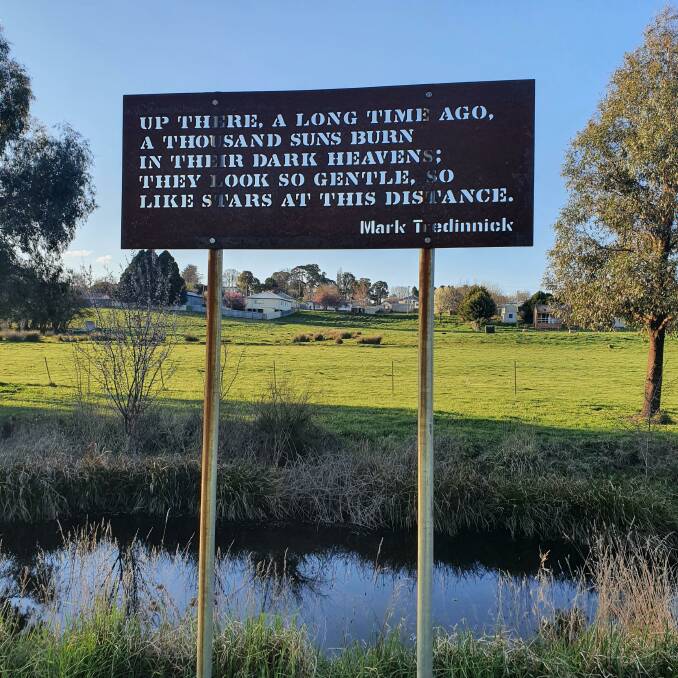 Indelible Stencil, poem by Mark Tredinnick installed on the Kiamma Creek in Crookwell, from the series of Indelible Stencils to be found across the STA region. Photo: Supplied. 