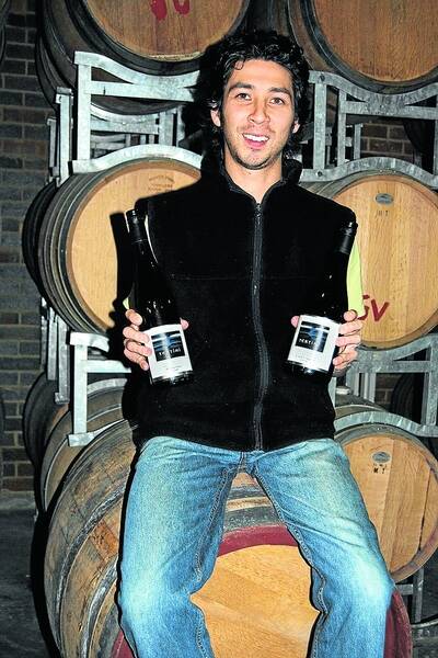 Winemaker Jonathon Holgate proundly shows off two of the award-winning Tertini wines. Photo Linda Lambrechts