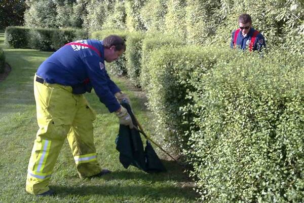 Fire and Rescue NSW firefighters Ron Dodwell and Rudy Vandermer bag a copperhead snake in Bowral late last month.