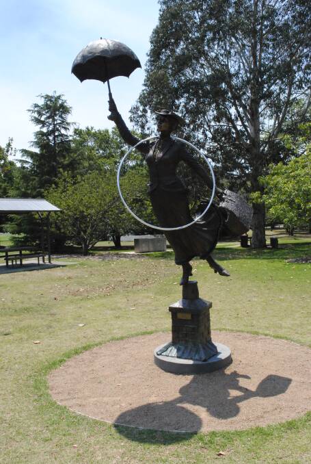 The Mary Poppins statue in Glebe Park, Bowral adorned with one of former world champion hula-hoop artiste Mat Plendl's hula-hoops. Photo by Megan Drapalski