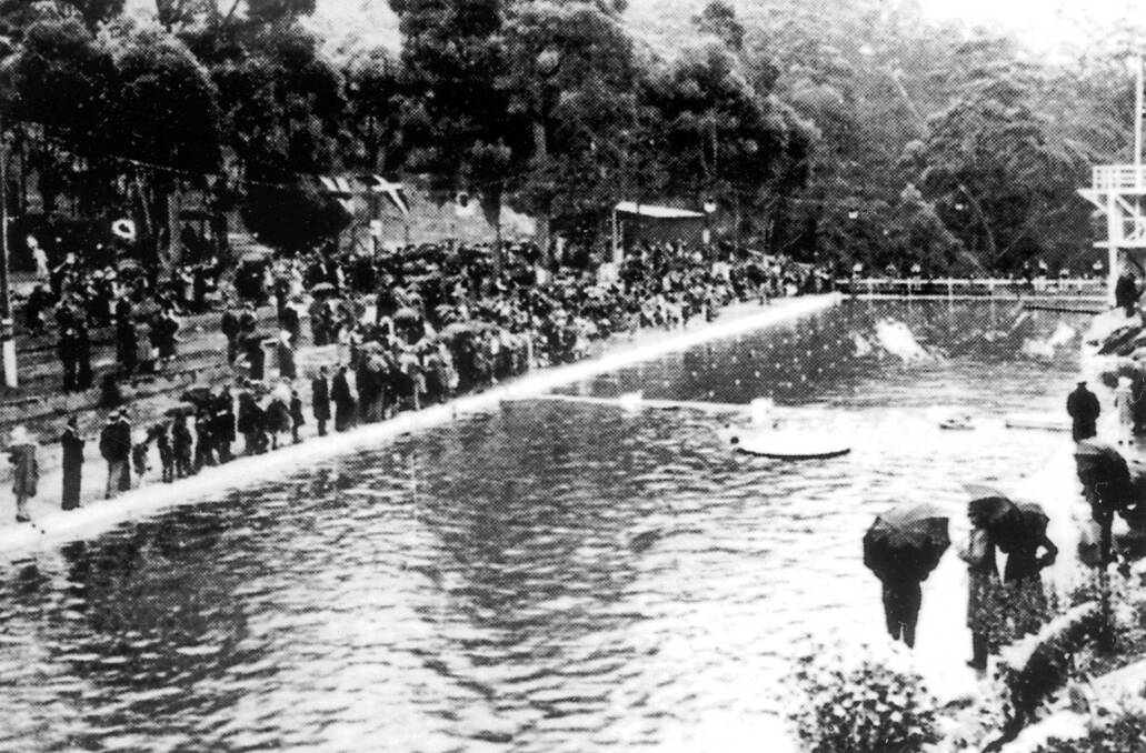 Left: COOL SETTING: Mittagong Baths prior to it becoming an Olympic Pool in 1959. 
Right: IN THE WET: This photo shows a carnival on a wet day at Mittagong Swimming Pool. 
 
Photos: BDH&FHS