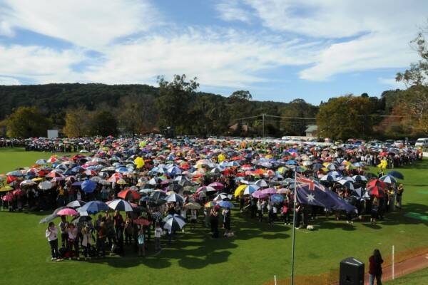 The 2000 or so people gathered in the shape of Mary Poppins on Bradman Oval, Bowral. Photo by Mark Bransdon