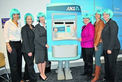 Blue haired beauties: ANZ employees Kylie Plowman, Helen Sutton, Jenny Hart, �Kev the ATM� (Rhiann Drewe), Relay for Life committee members Judi O'Brien and Jodie Iliani and ANZ staff member Bel Gauci. 	Photo by Emma Biscoe