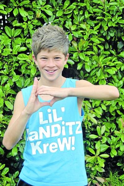 Young Talent Time contestant, Benny Turland, proudly shows off the 'Lil' Banditz Krew' symbol. Photo by Emma Biscoe