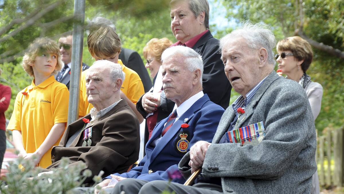 Three old diggers Arnold Sheedy, Gerald Harris and Mac Curr listen to the service at Bundanoon. 